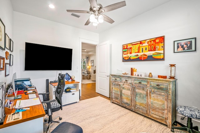 office with hardwood / wood-style flooring and ceiling fan