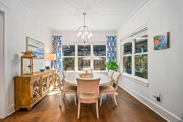 dining room with ornamental molding, wood-type flooring, and an inviting chandelier