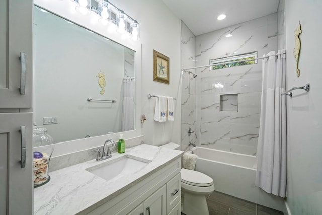 full bathroom with vanity, toilet, and shower / bath combo with shower curtain