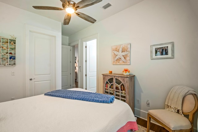 bedroom featuring wood-type flooring and ceiling fan