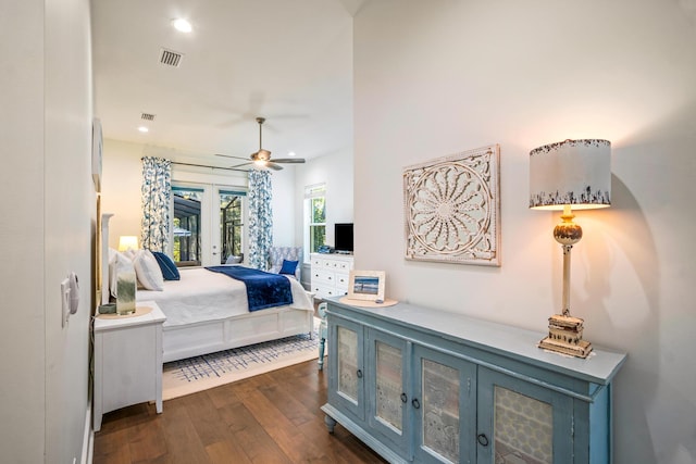 bedroom with access to exterior, dark hardwood / wood-style flooring, and french doors