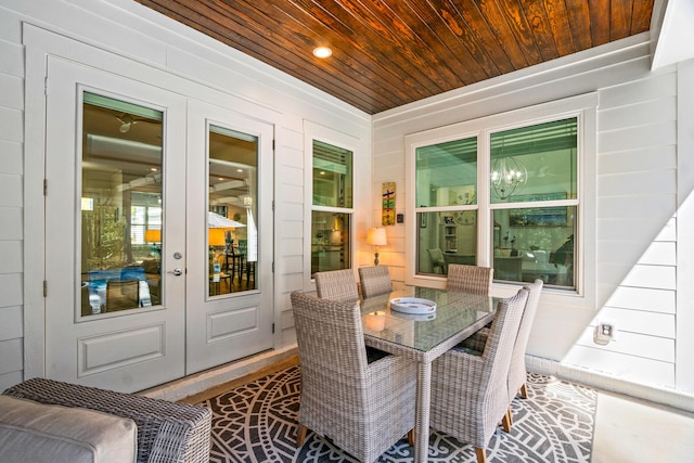 sunroom with french doors and wooden ceiling