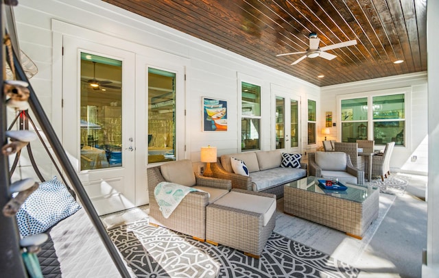 sunroom / solarium featuring wood ceiling, french doors, and ceiling fan