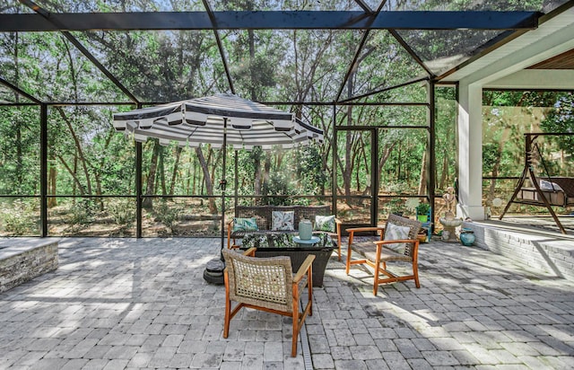 view of patio featuring outdoor lounge area and a lanai