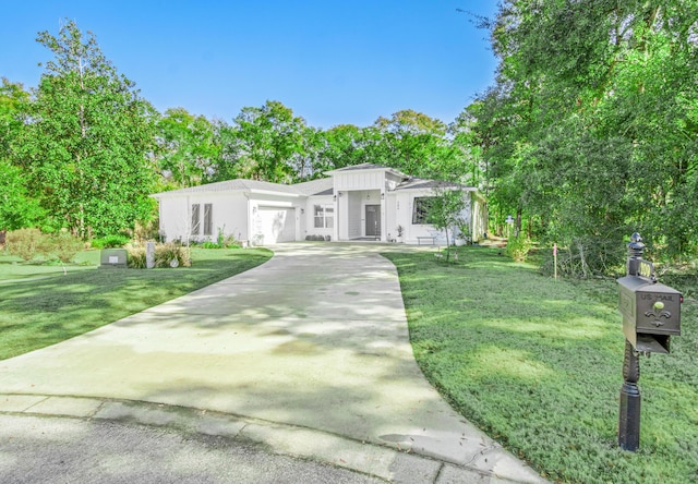 view of front of home with a front lawn