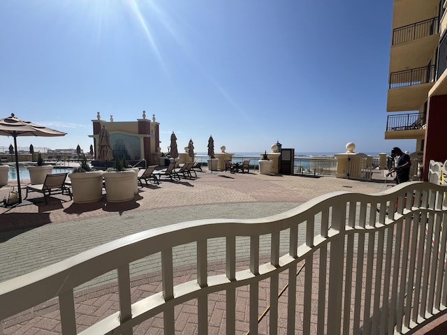 view of patio featuring a water view