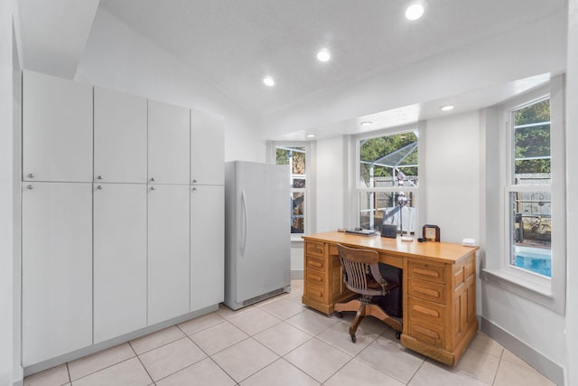 tiled office with vaulted ceiling