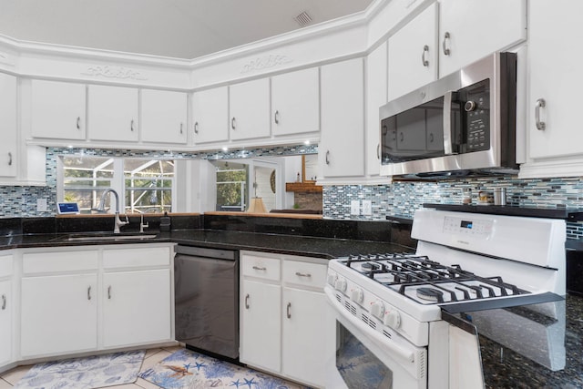 kitchen featuring sink, white cabinetry, black dishwasher, tasteful backsplash, and white gas stove