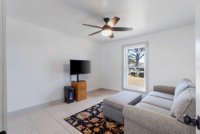 living room featuring ceiling fan and light tile patterned flooring