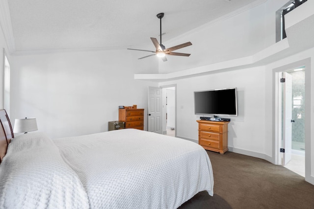 bedroom featuring crown molding, ceiling fan, dark carpet, and ensuite bath