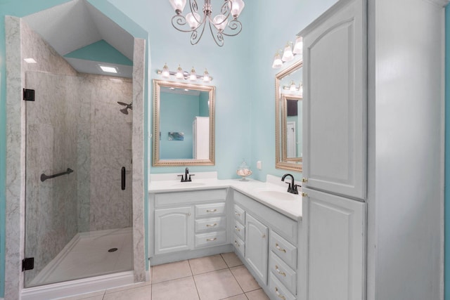 bathroom with vanity, a shower with shower door, tile patterned floors, and lofted ceiling