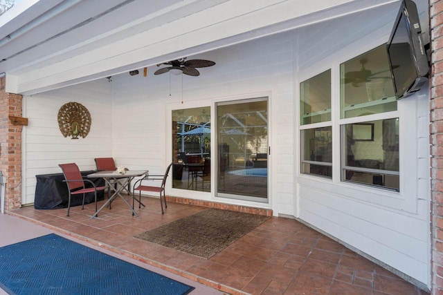 view of patio / terrace featuring ceiling fan