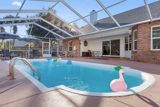 view of swimming pool with a lanai and a patio