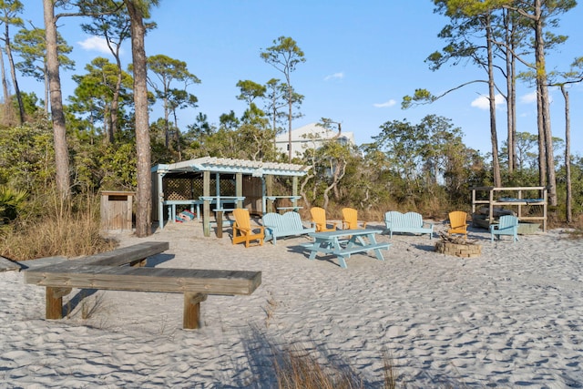 exterior space with a fire pit