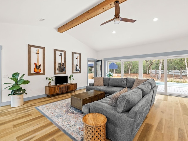 living room with lofted ceiling with beams, ceiling fan, and light hardwood / wood-style floors