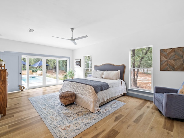 bedroom with ceiling fan, access to exterior, and light wood-type flooring