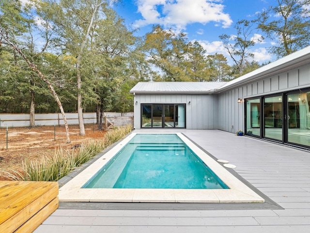 view of pool with a wooden deck