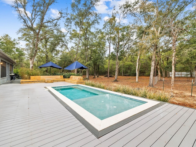 view of swimming pool featuring a wooden deck