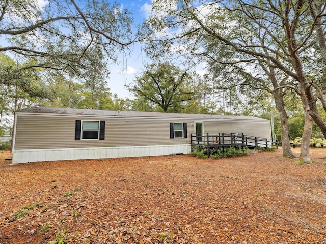 back of property featuring a deck