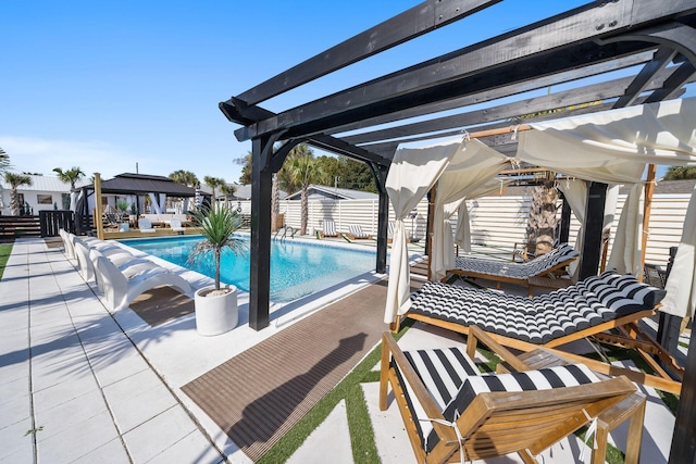 view of swimming pool featuring a pergola and a patio