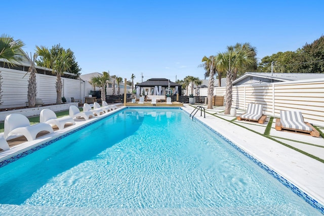 view of swimming pool featuring a gazebo