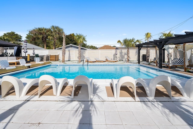 view of swimming pool with a patio area and a pergola