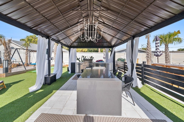 view of patio / terrace featuring area for grilling and a gazebo