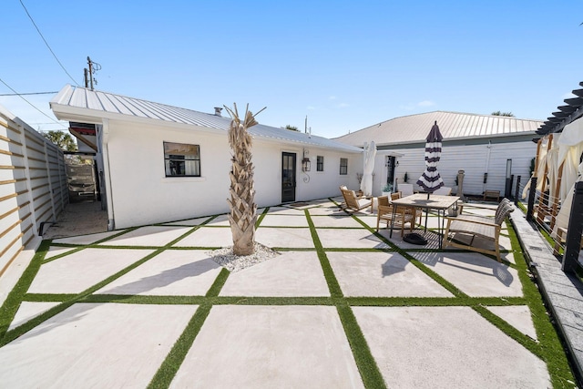 rear view of house with a patio area