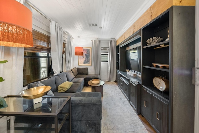 living room featuring plenty of natural light, light colored carpet, and wood ceiling