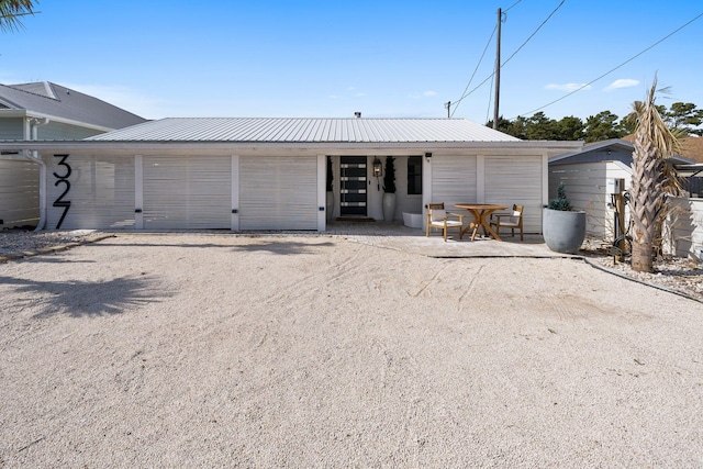 view of front of house featuring an outbuilding