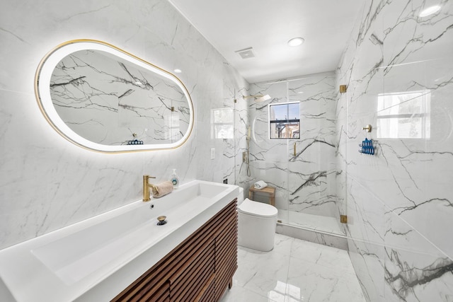 bathroom featuring toilet, tile walls, vanity, and a shower with shower door