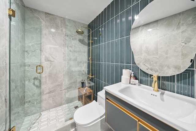 bathroom featuring vanity, tile walls, an enclosed shower, and toilet