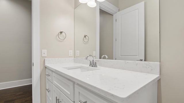 bathroom with vanity and wood-type flooring