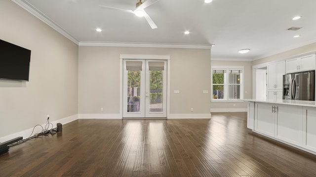 unfurnished living room featuring crown molding, dark hardwood / wood-style floors, ceiling fan, and french doors