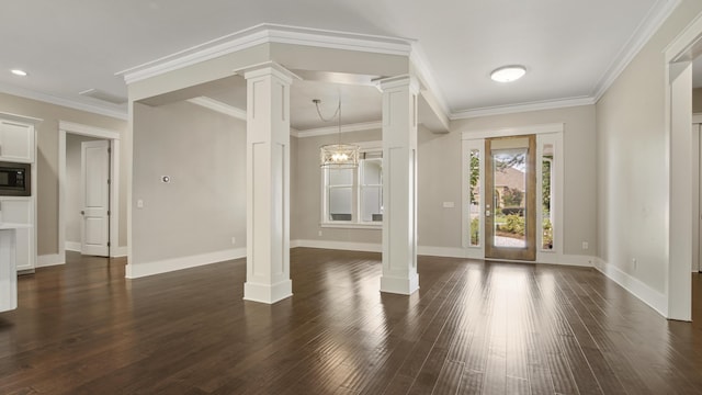 entryway with crown molding, dark wood-type flooring, and ornate columns