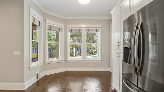 kitchen featuring white cabinetry, stainless steel refrigerator with ice dispenser, dark hardwood / wood-style floors, and crown molding