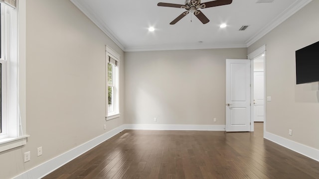 empty room with ornamental molding, ceiling fan, and dark hardwood / wood-style flooring