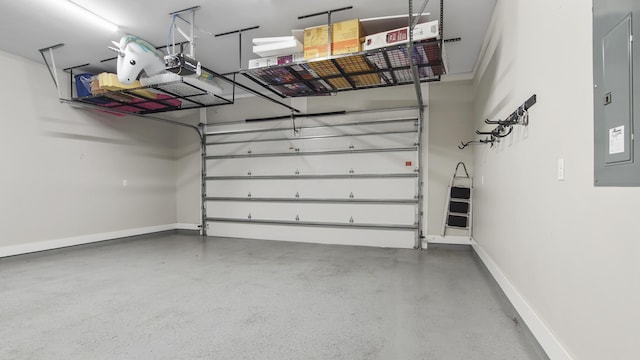 garage with a garage door opener and electric panel