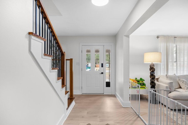 entryway with light hardwood / wood-style floors