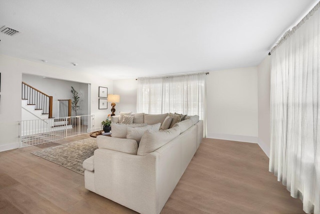 living room with light hardwood / wood-style flooring