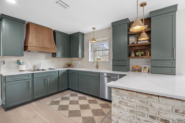 kitchen with sink, custom exhaust hood, light stone counters, hanging light fixtures, and dishwasher