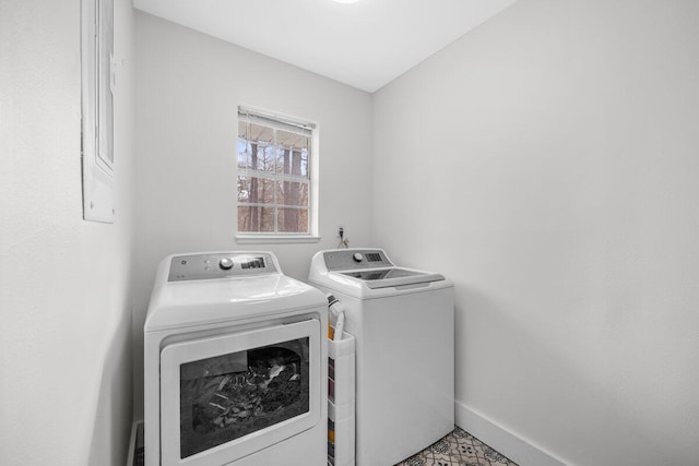 clothes washing area with washer and dryer