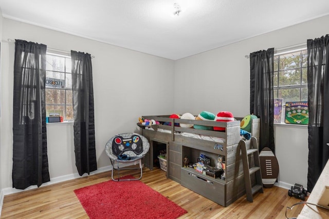 bedroom with light hardwood / wood-style floors