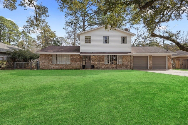 view of front of house featuring a garage and a front yard