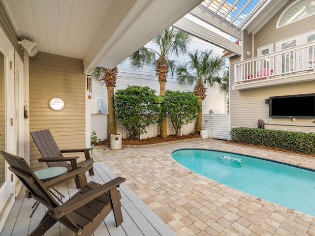 view of swimming pool with a patio