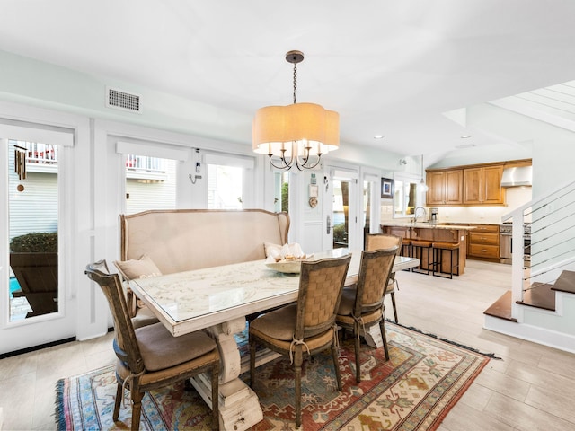 dining area featuring a chandelier