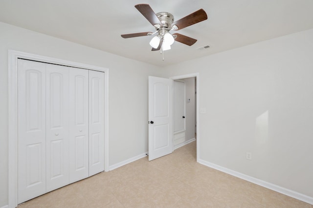 unfurnished bedroom with a ceiling fan, baseboards, visible vents, and a closet