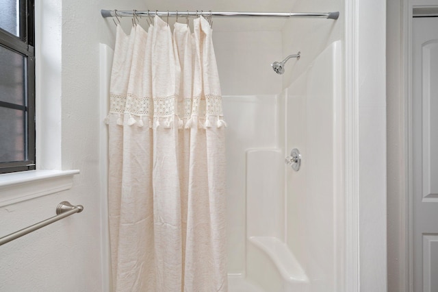 bathroom with a shower with shower curtain