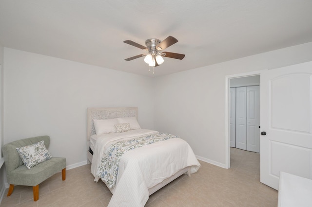 bedroom with baseboards and a ceiling fan