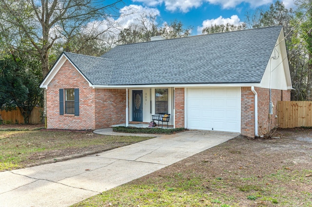 view of front facade with driveway, a chimney, roof with shingles, fence, and brick siding